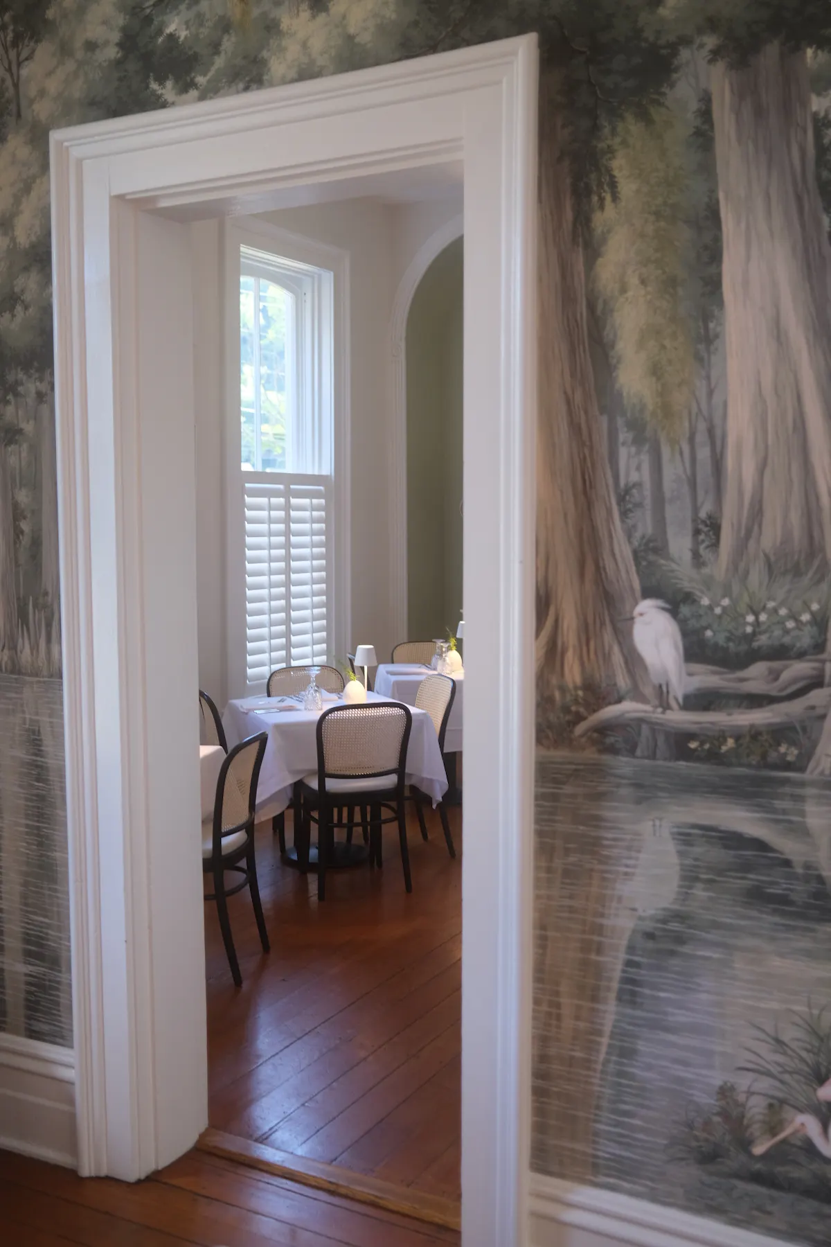 a room filled with furniture and a large window